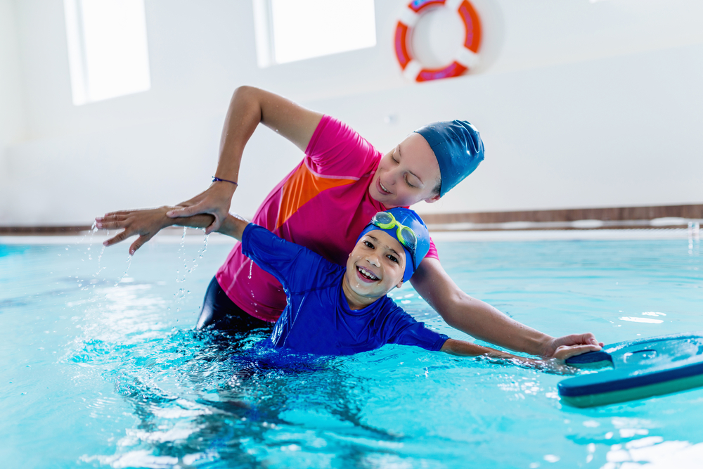 Pro Swim Shop -Pro Swim Shop boy taking swim lessons at indoor pool a1 scuba